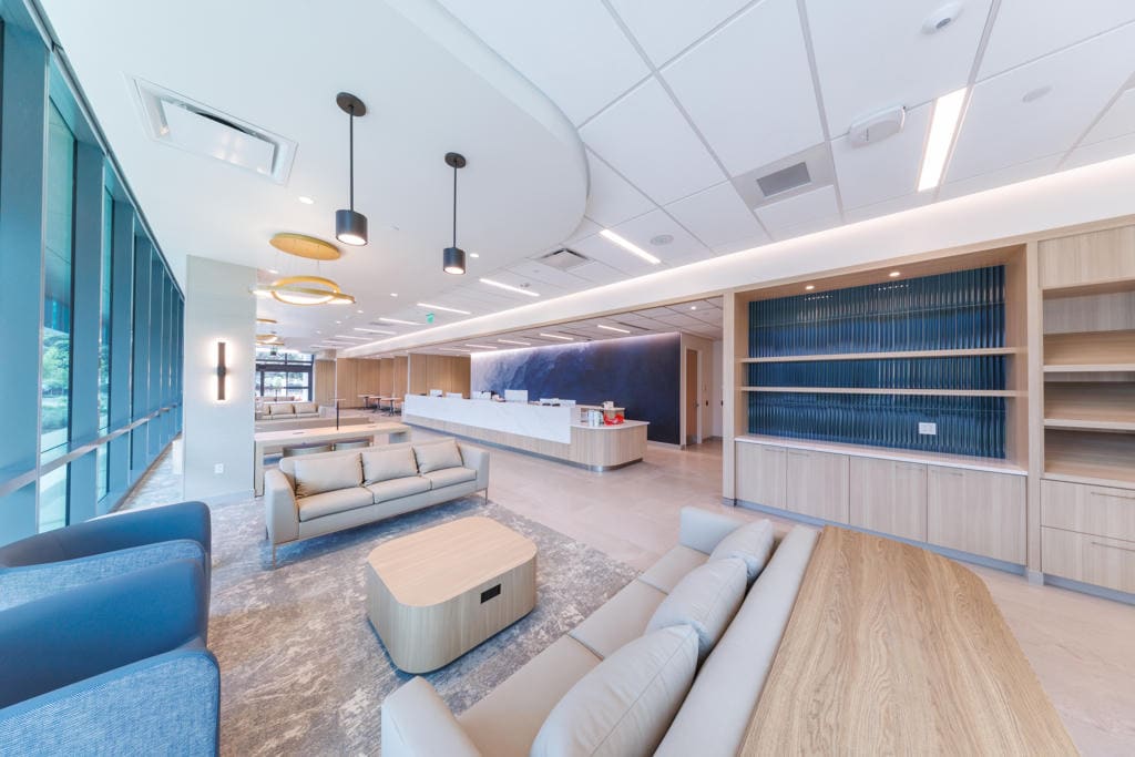 Spacious lobby lounge with sofas and floor-to-ceiling windows